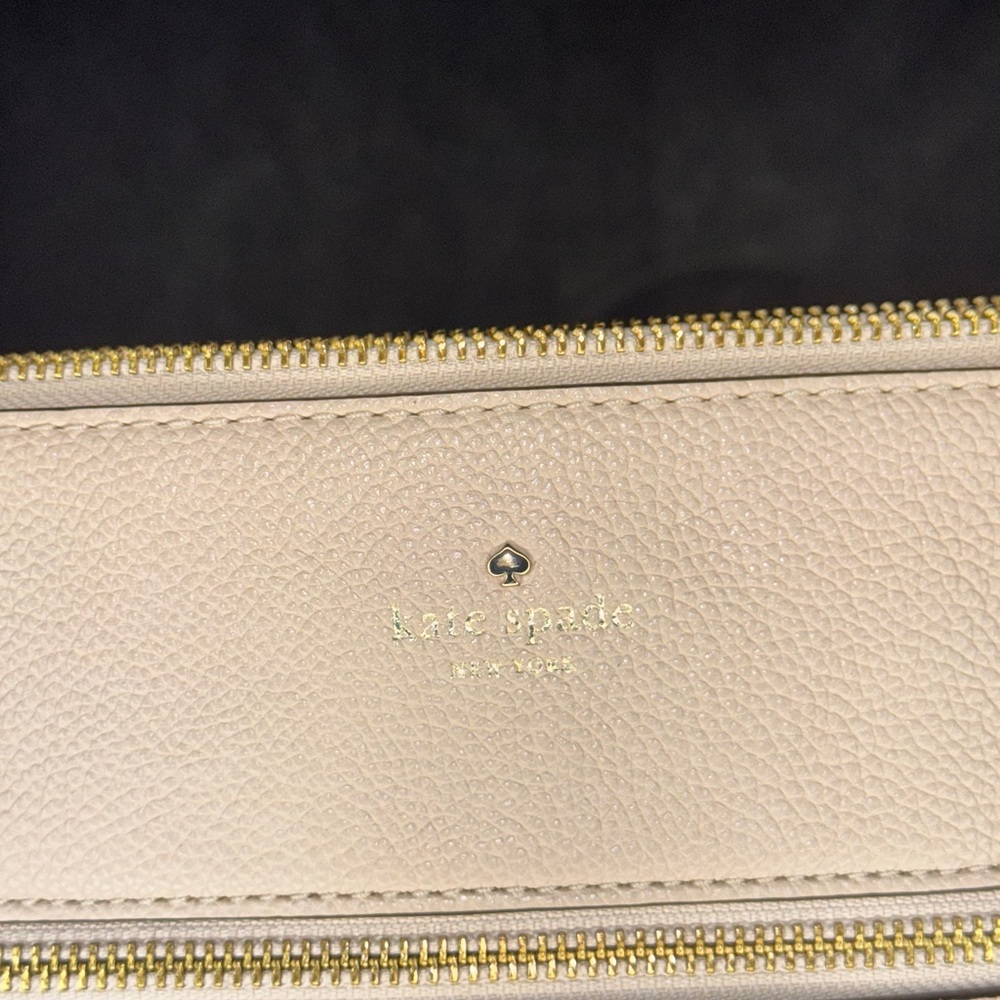 Kate Spade Cream Cosmetic Case with Gold Accents